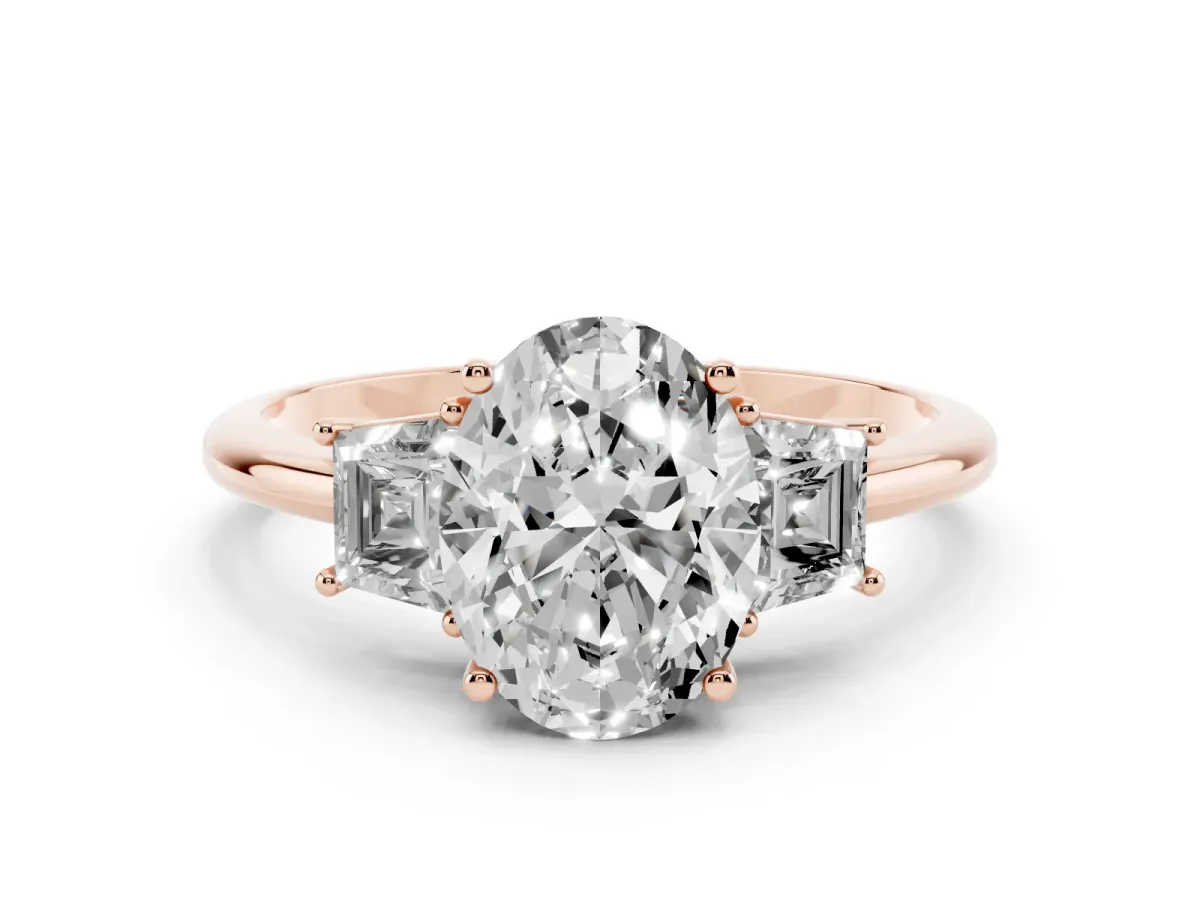 Oval Cut Diamond Three-Stone Ring with Trapezoid Side Stones and Prong Setting Rose gold