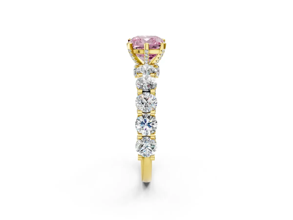 Fancy Pink Cushion Cut Diamond Side Stone Engagement Ring with Four-Prong Setting Yellow gold