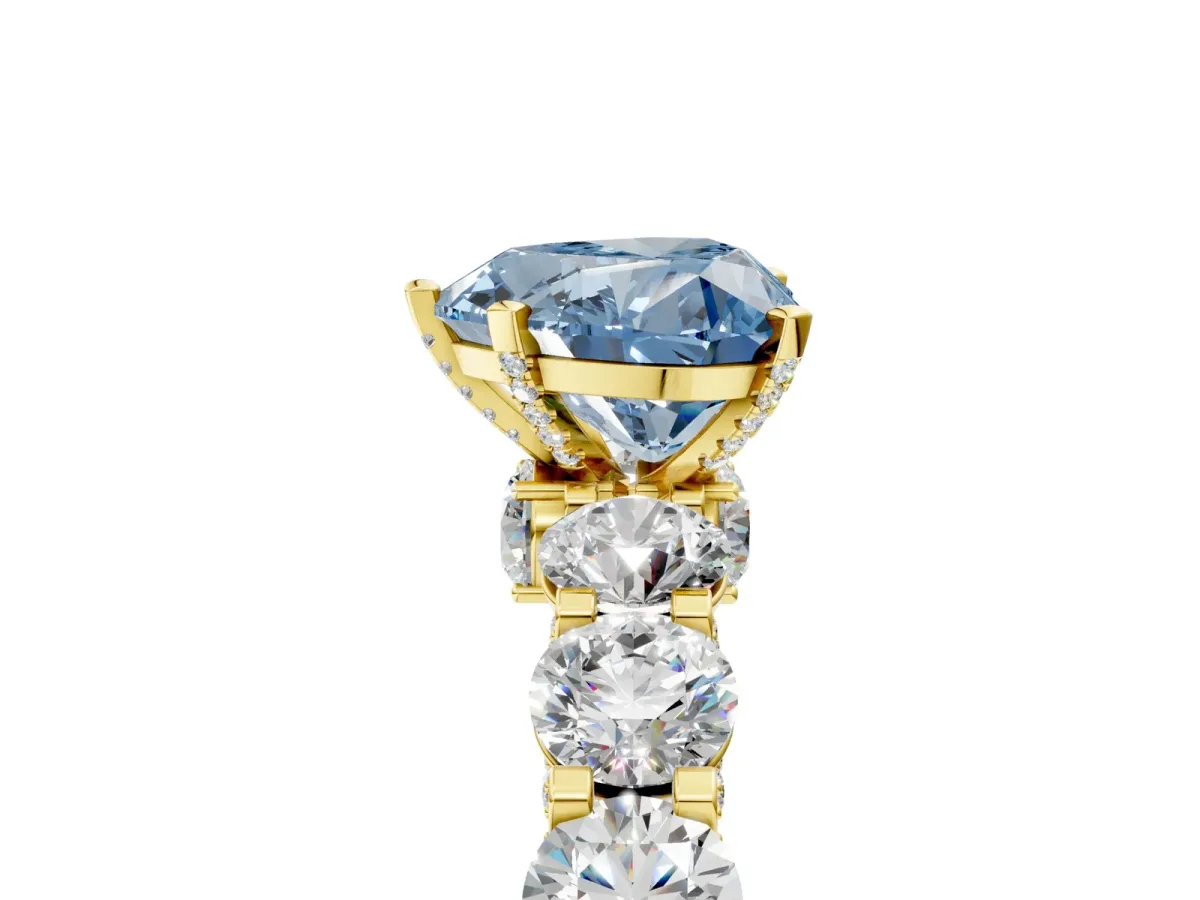 Fancy Blue Heart Cut Diamond Side Stone Engagement Ring with Four-Prong Setting Yellow gold