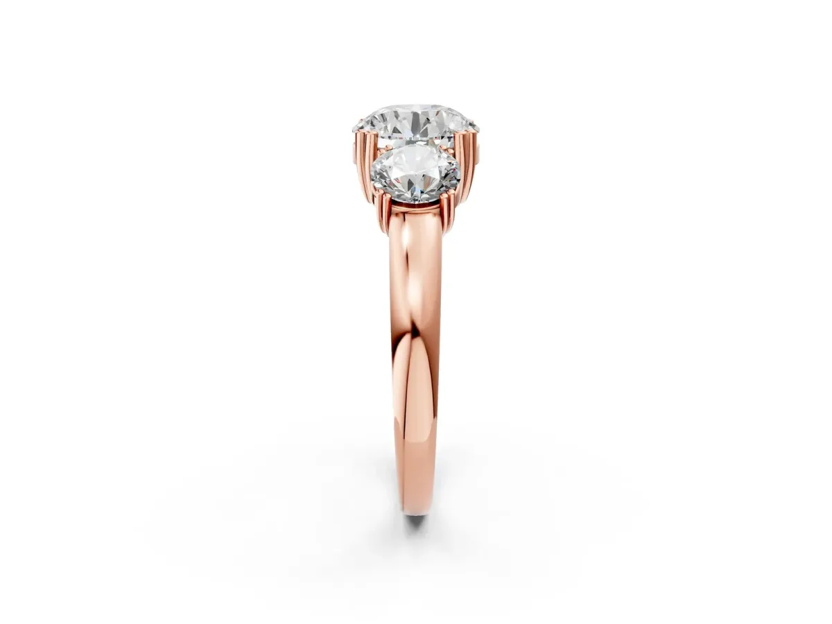 Three-Stone Round Cut Cut Diamond Ring with Channel Set Band and Four-Prong Setting Rose gold