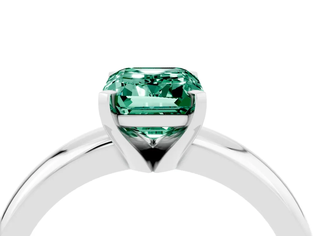 Emerald Cut Green Sapphire Solitaire Engagement Ring with Round Band and Four-Prong Setting Silver
