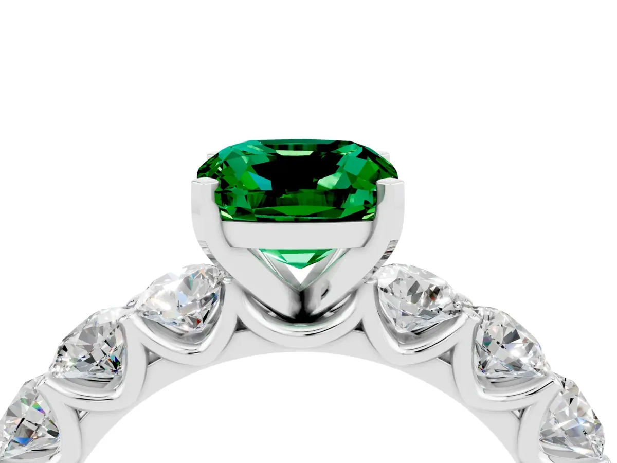 Cushion Cut Emerald Prong Setting with Side Stones on a Pave Band Platinum