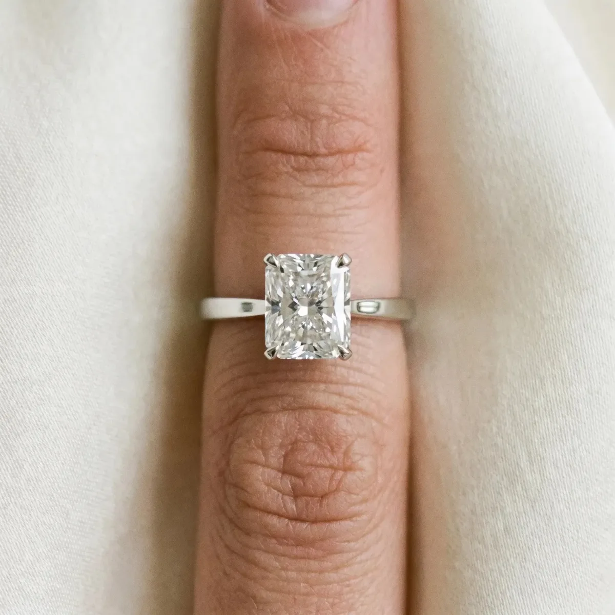 Radiant Cut Diamond Solitaire Engagement Ring with Classic Band and Four-Prong Setting Silver