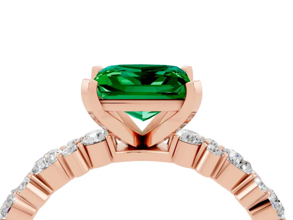 Princess Cut Emerald Side Stone Solitaire Ring with Round and Four-Prong Setting Rose gold