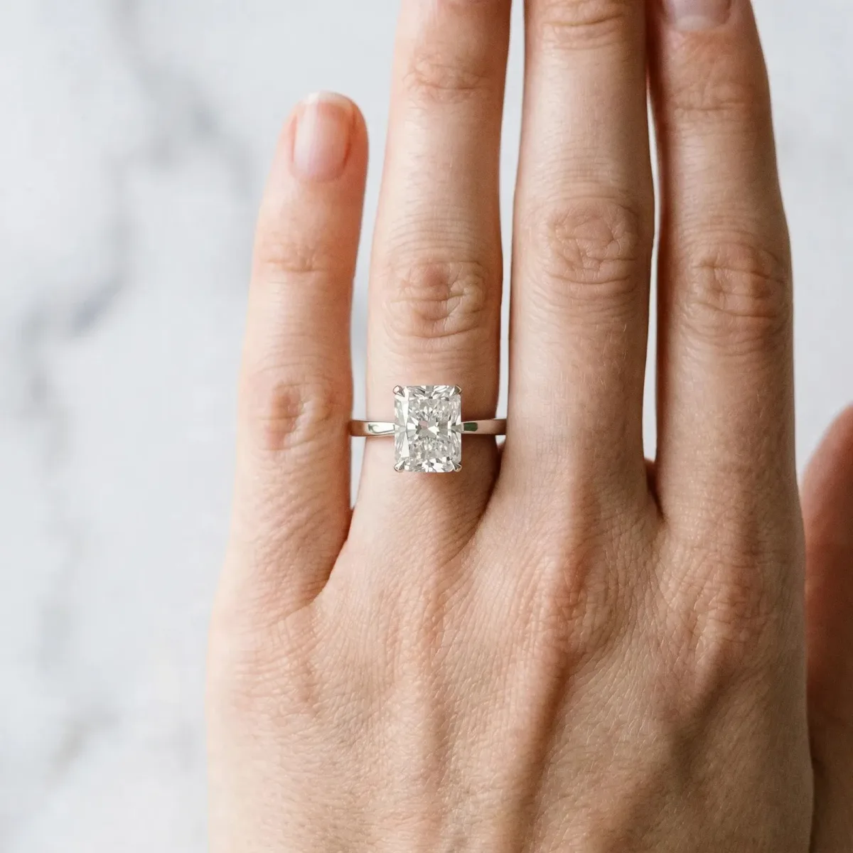 Radiant Cut Diamond Solitaire Engagement Ring with Classic Band and Four-Prong Setting Silver
