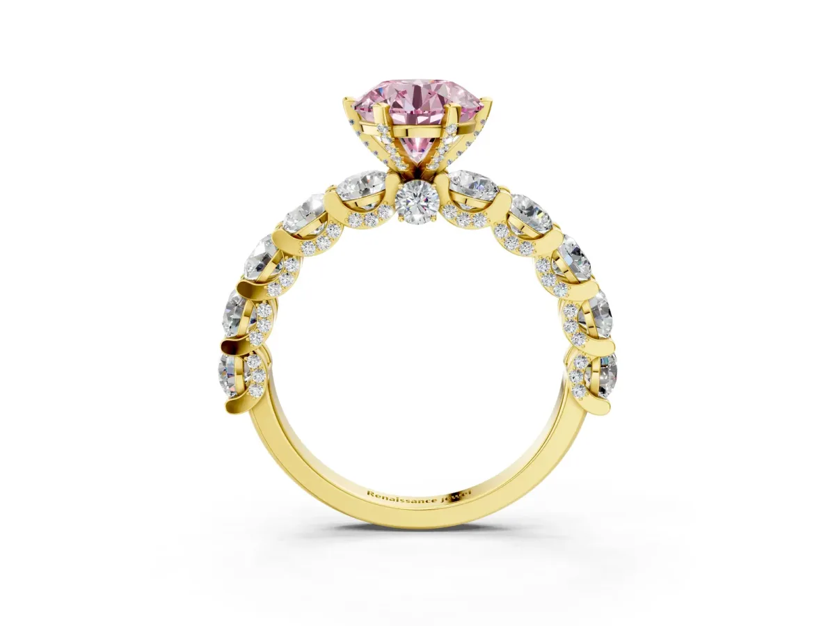 Fancy Pink Round Cut Diamond Side Stone Engagement Ring with Four-Prong Setting Yellow gold