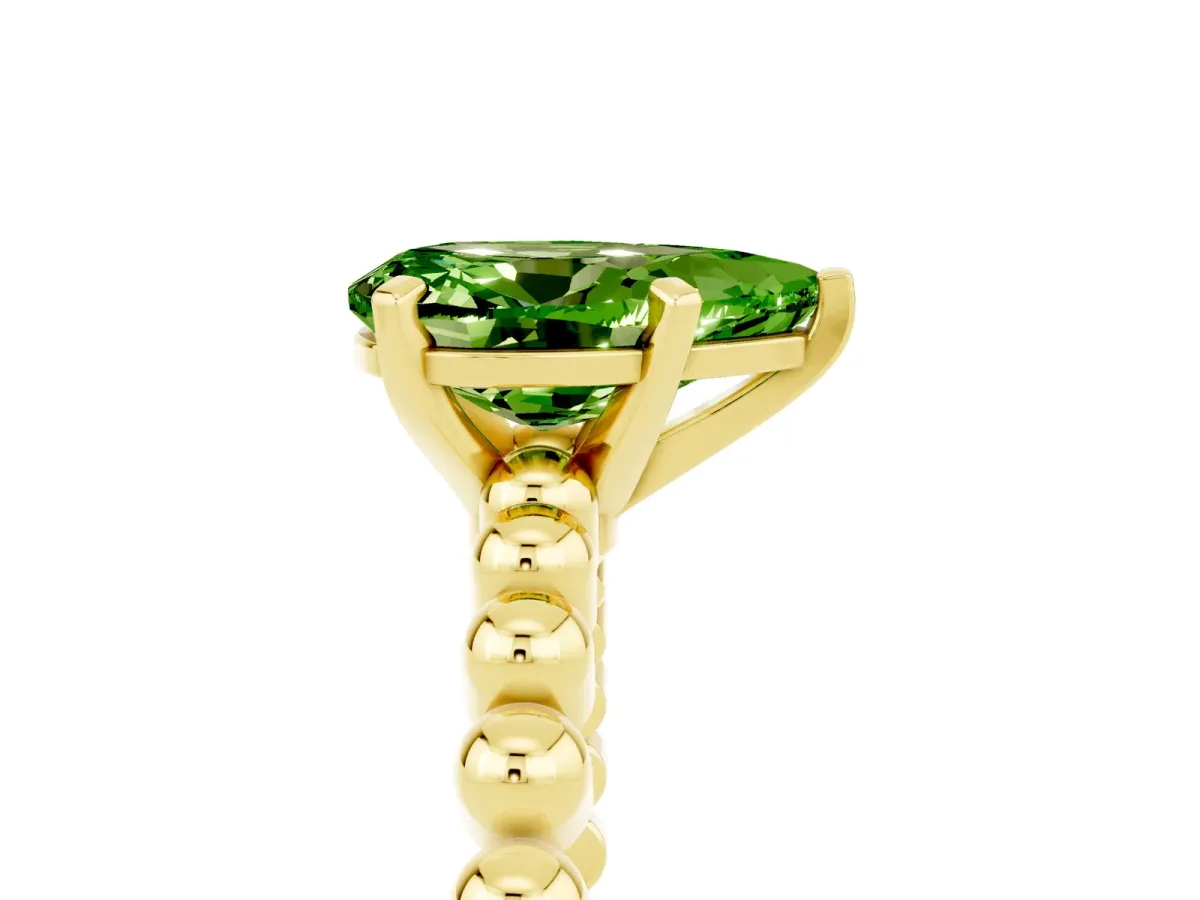 Pear Cut Peridot Solitaire Ring with Beaded Band and Prong Setting Yellow gold