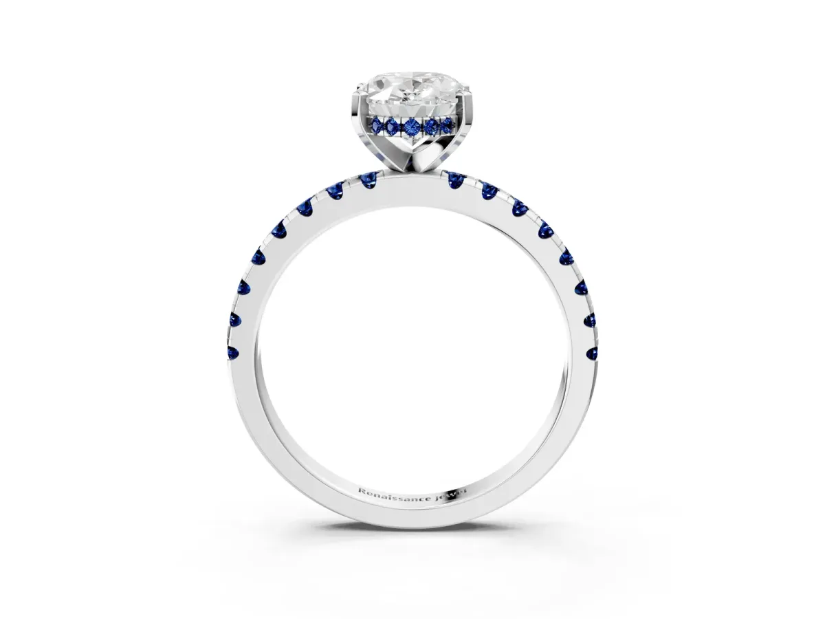 Oval Cut Diamond Solitaire Ring with Round Blue Sapphire Pavé Band and Four-Prong Setting Silver