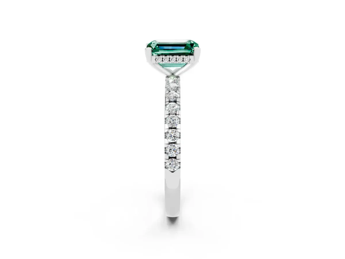Emerald Cut Green Sapphire Solitaire Ring with Round Pavé Band and Four-Prong Setting Silver