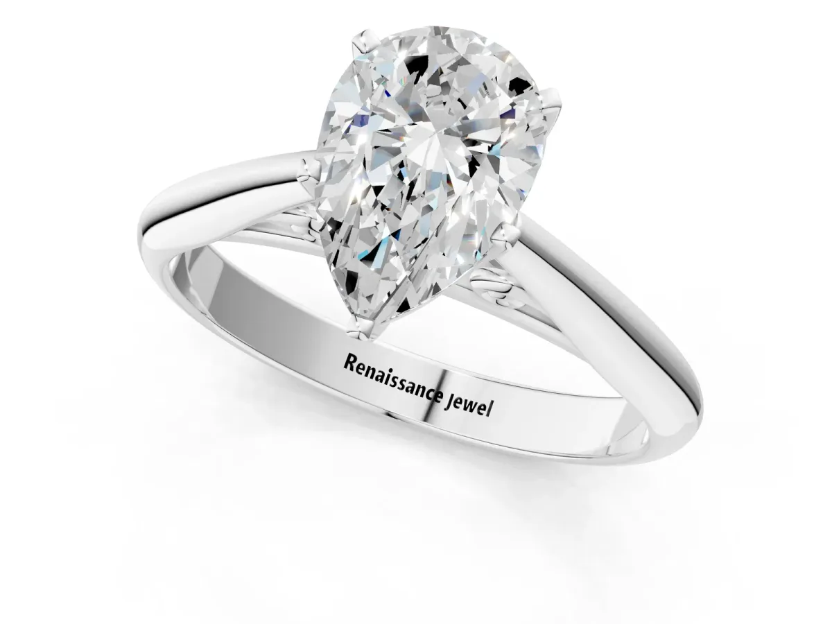 Pear Cut Diamond Solitaire Engagement Ring with Cathedral Setting and Four-Prong Mount White gold