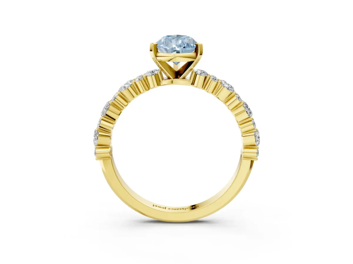 Fancy Blue Pear Cut Diamond Side Stone Solitaire Ring with Round and Four-Prong Setting Yellow gold