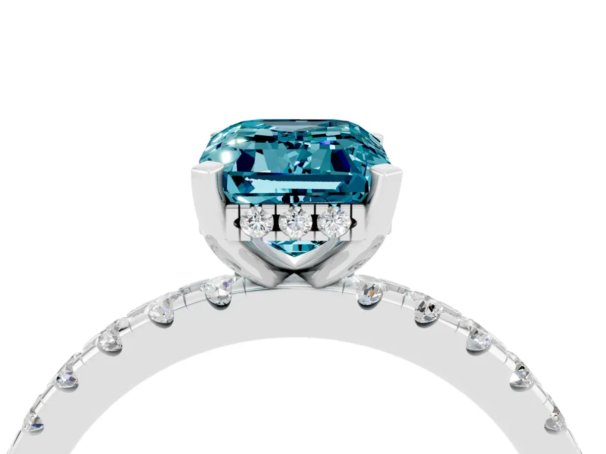 Emerald Cut Blue Topaz Solitaire Ring with Round Pavé Band and Four-Prong Setting Silver