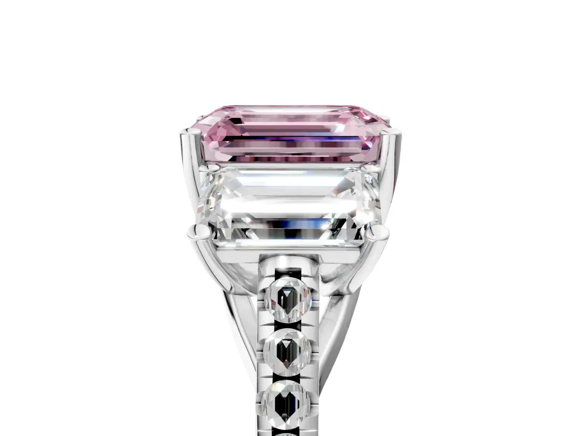 Fancy Pink Three-Stone Emerald Cut Diamond Ring with Round Pavé Band and Prong Setting Platinum