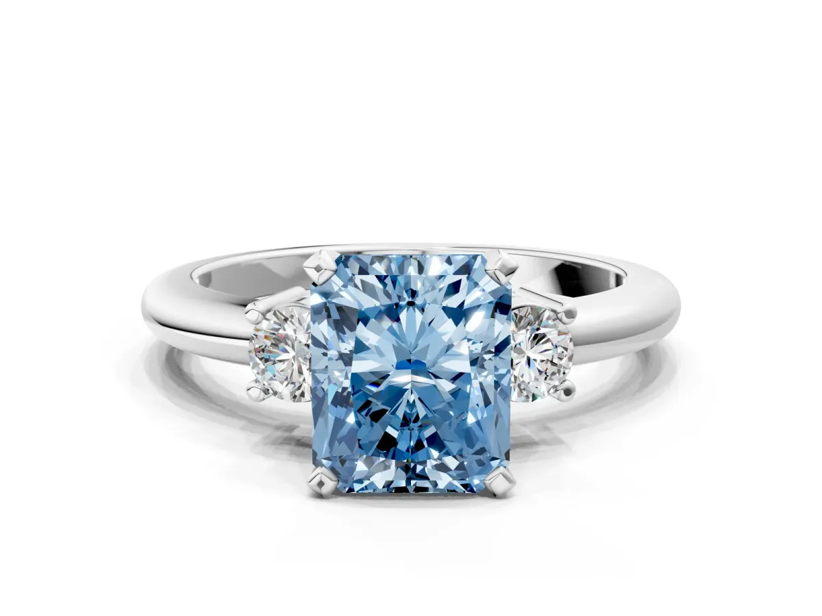 Fancy Blue Three-Stone Radiant Cut Cut Diamond Solitaire with Prong Setting and Classic Band Platinum