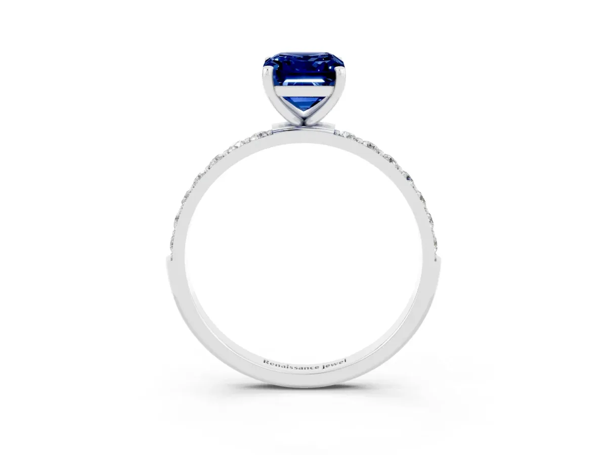 Emerald Cut Blue Sapphire Solitaire Ring with Round Pavé Band and Prong Setting Silver