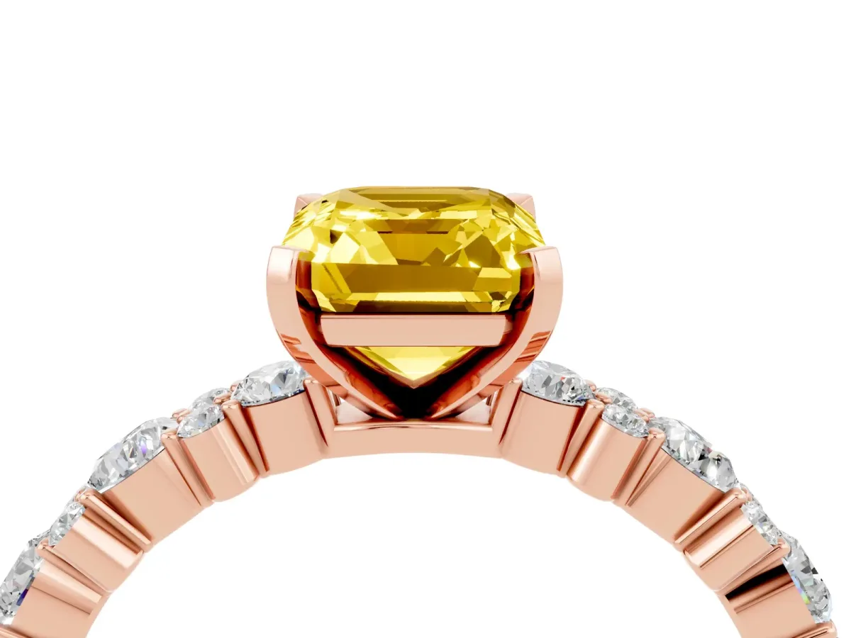 Emerald Cut Yellow Sapphire Side Stone Solitaire Ring with Round and Four-Prong Setting Rose gold
