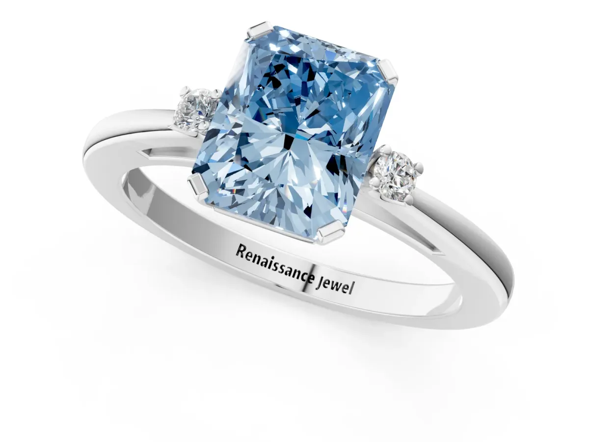 Fancy Blue Radiant Cut Cut Three-Stone Solitaire Ring with Round Accent Diamonds and Four-Prong Setting Platinum