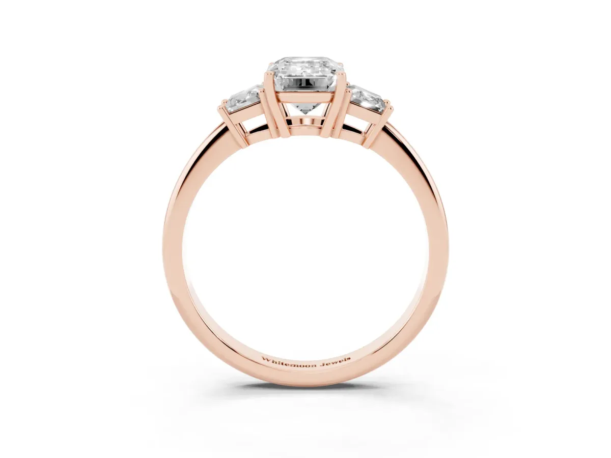 Emerald Cut Diamond Three-Stone Ring with Trapezoid Side Stones and Prong Setting Rose gold