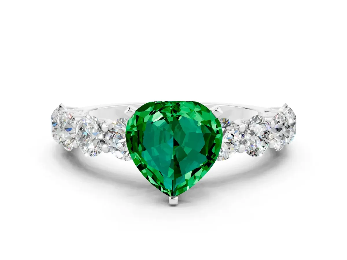 Heart Cut Emerald Prong Setting with Side Stones on a Pave Band Silver