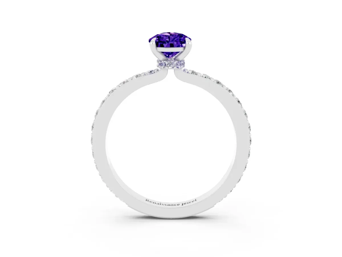 Pear Cut Tanzanite Solitaire Engagement Ring with Pavé Band and Four-Prong Setting Silver