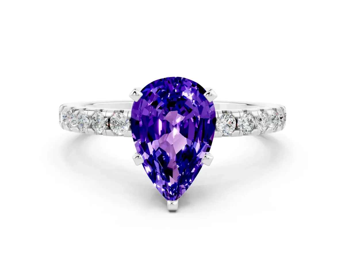 Pear Cut Tanzanite Solitaire Ring with Round Pavé Band and Four-Prong Setting Silver
