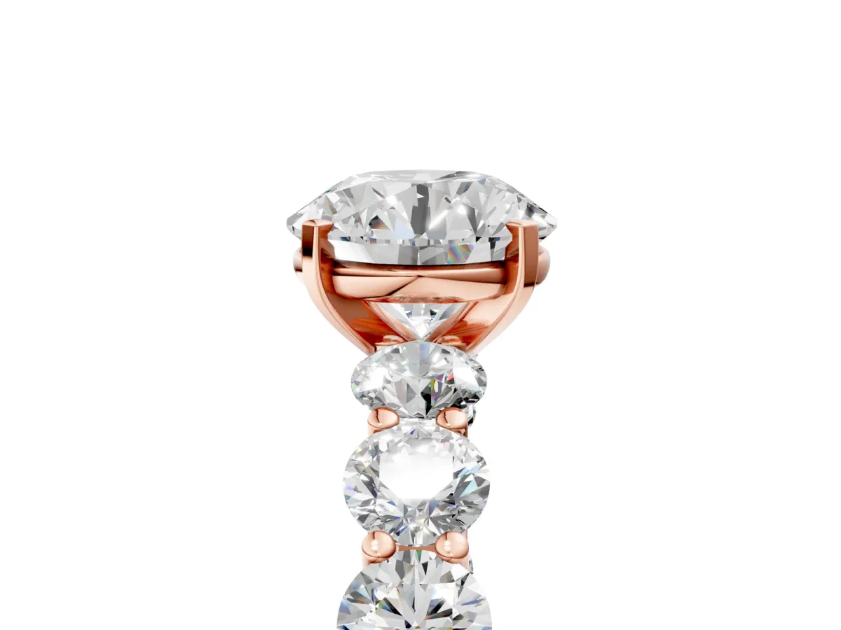 Round Cut Diamond Prong Setting with Side Stones on a Pave Band Rose gold