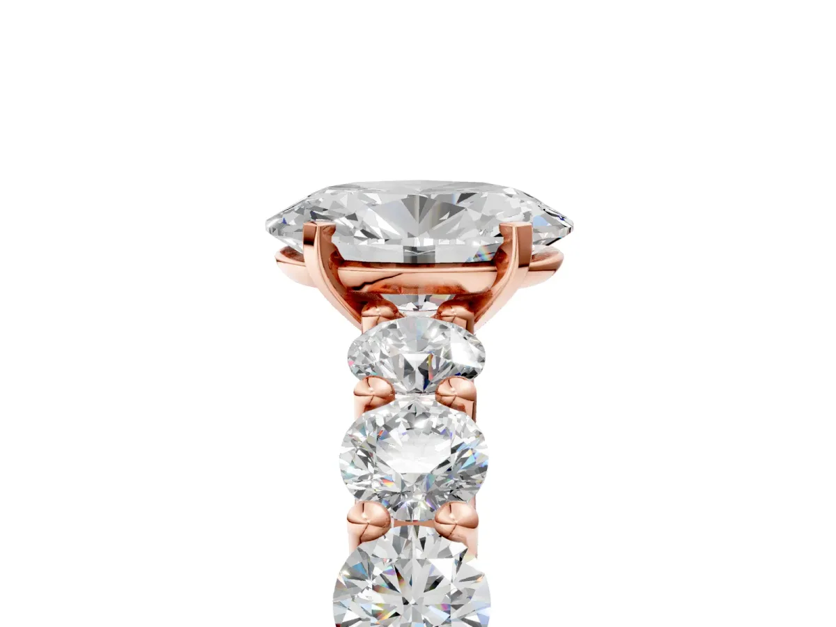 Oval Cut Diamond Prong Setting with Side Stones on a Pave Band Rose gold