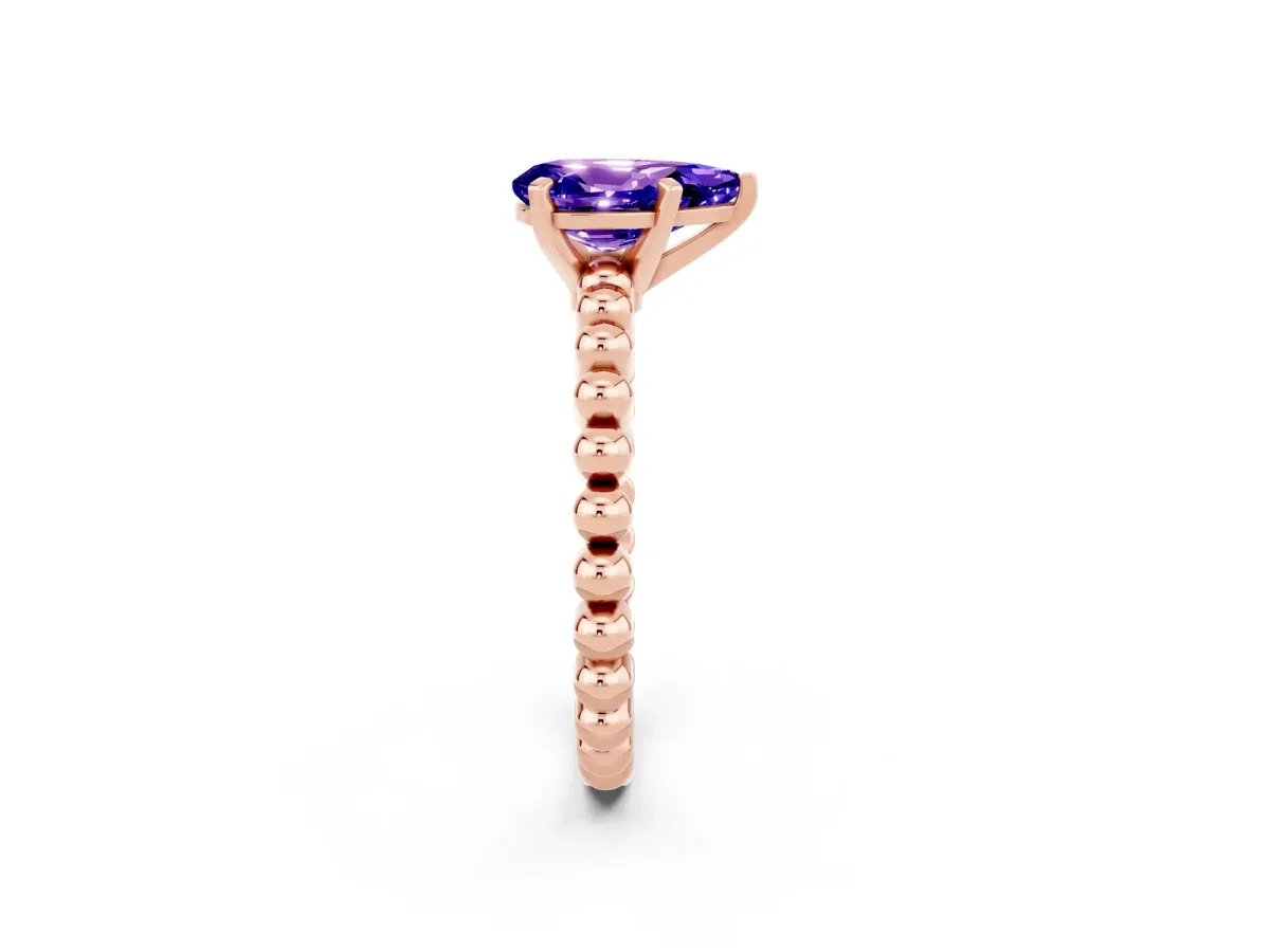 Pear Cut Tanzanite Solitaire Ring with Beaded Band and Prong Setting Rose gold