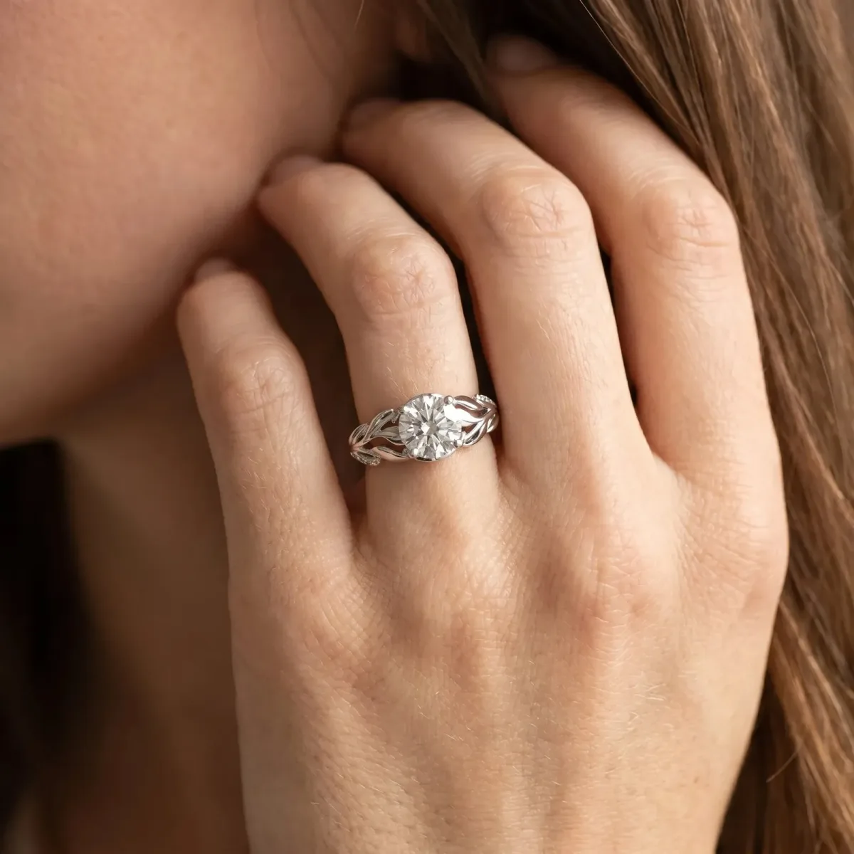 Oval Cut Diamond Leaf-Inspired Engagement Ring with Round Accents and Prong Setting Platinum