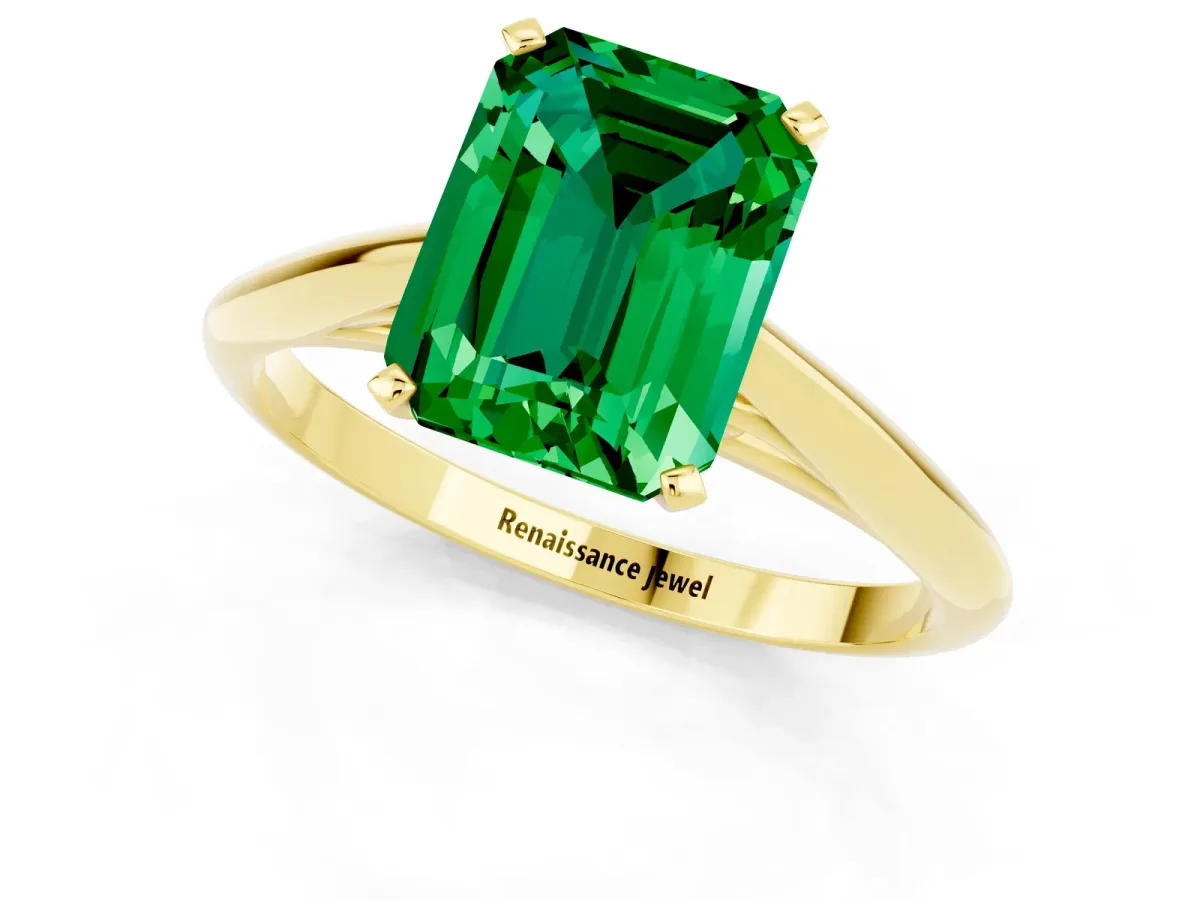 Emerald Cut Emerald Solitaire Engagement Ring with Cathedral Setting and Four-Prong Mount Yellow gold