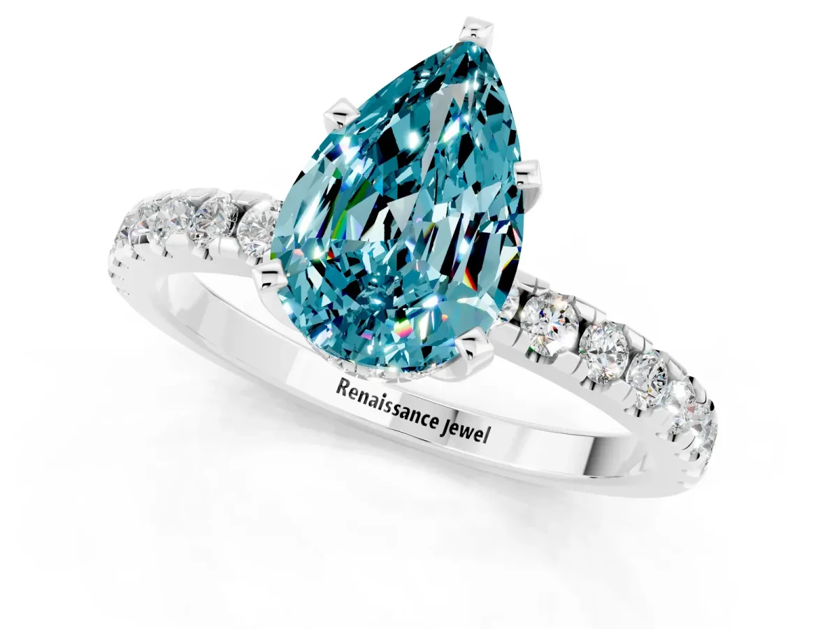 Pear Cut Blue Topaz Solitaire Ring with Round Pavé Band and Four-Prong Setting Silver