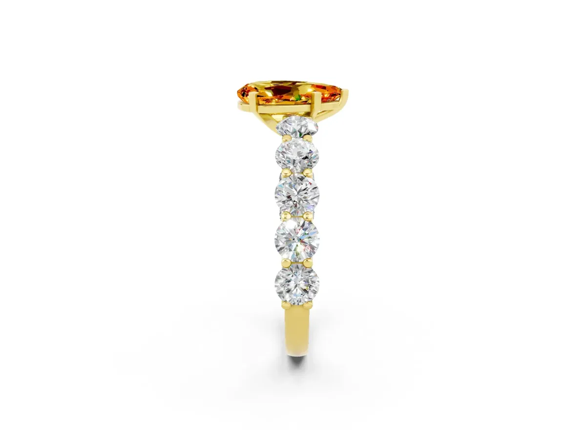 Pear Cut Citrine Prong Setting with Side Stones on a Pave Band Yellow gold