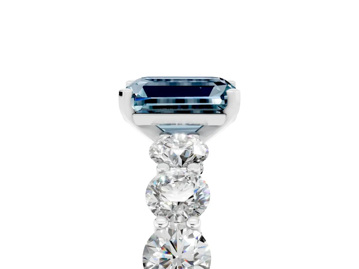 Emerald Cut Aquamarine Prong Setting with Side Stones on a Pave Band Silver
