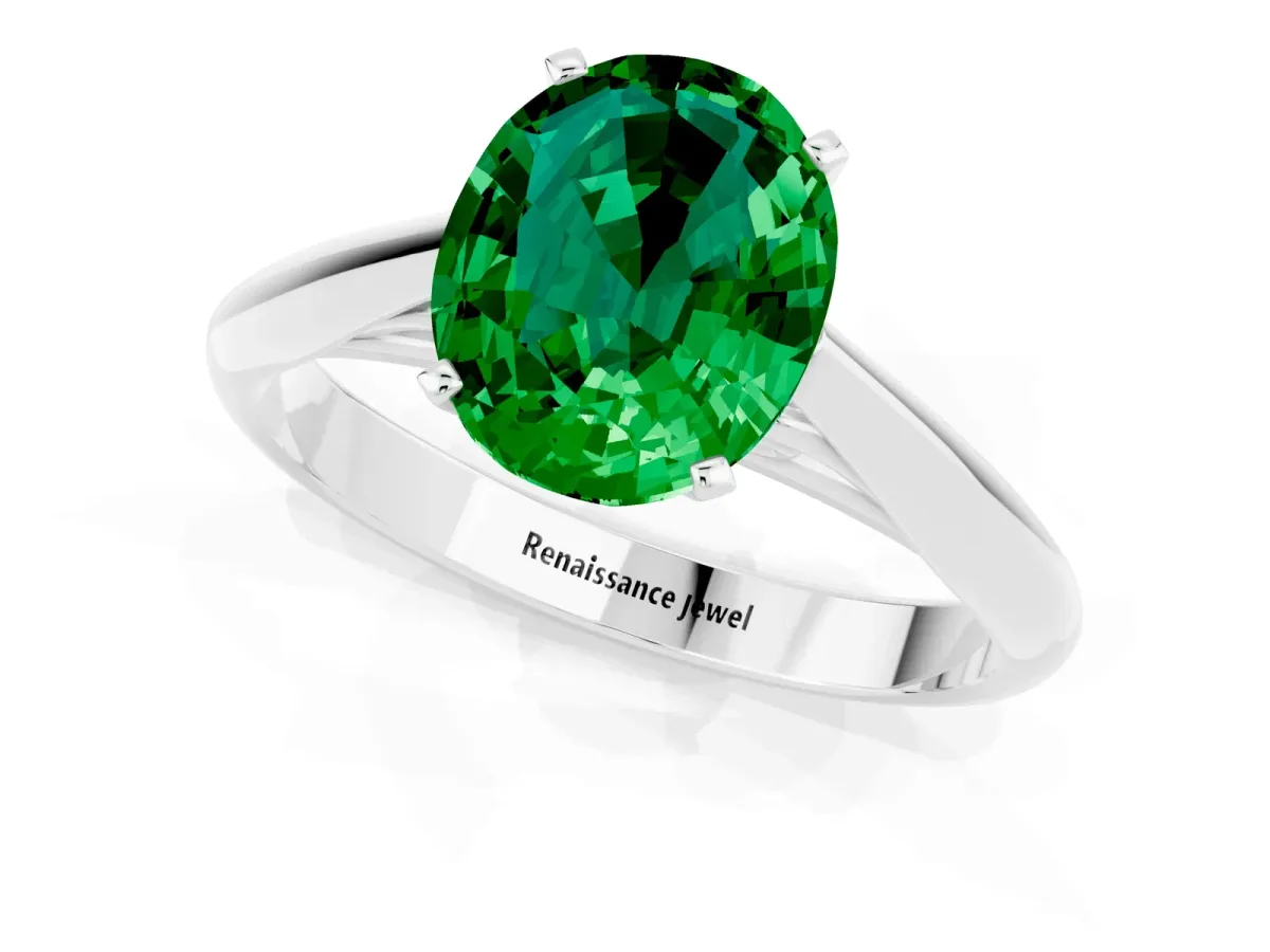 Oval Cut Emerald Solitaire Engagement Ring with Cathedral Setting and Four-Prong Mount White gold
