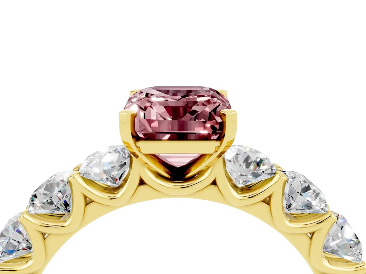 Emerald Cut Morganite Prong Setting with Side Stones on a Pave Band Yellow gold