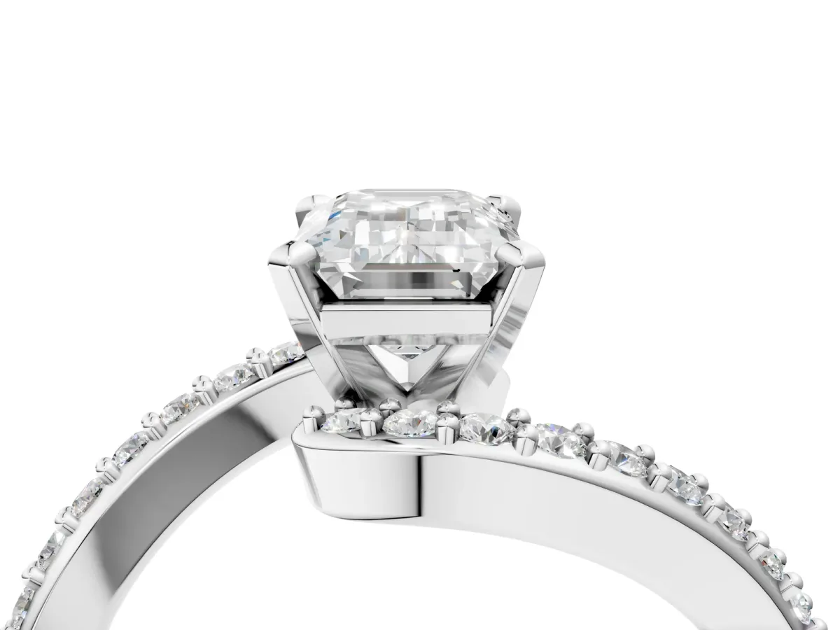 Emerald Cut Solitaire Twist Band with Pave Set Diamonds and Four-Prong Setting Platinum