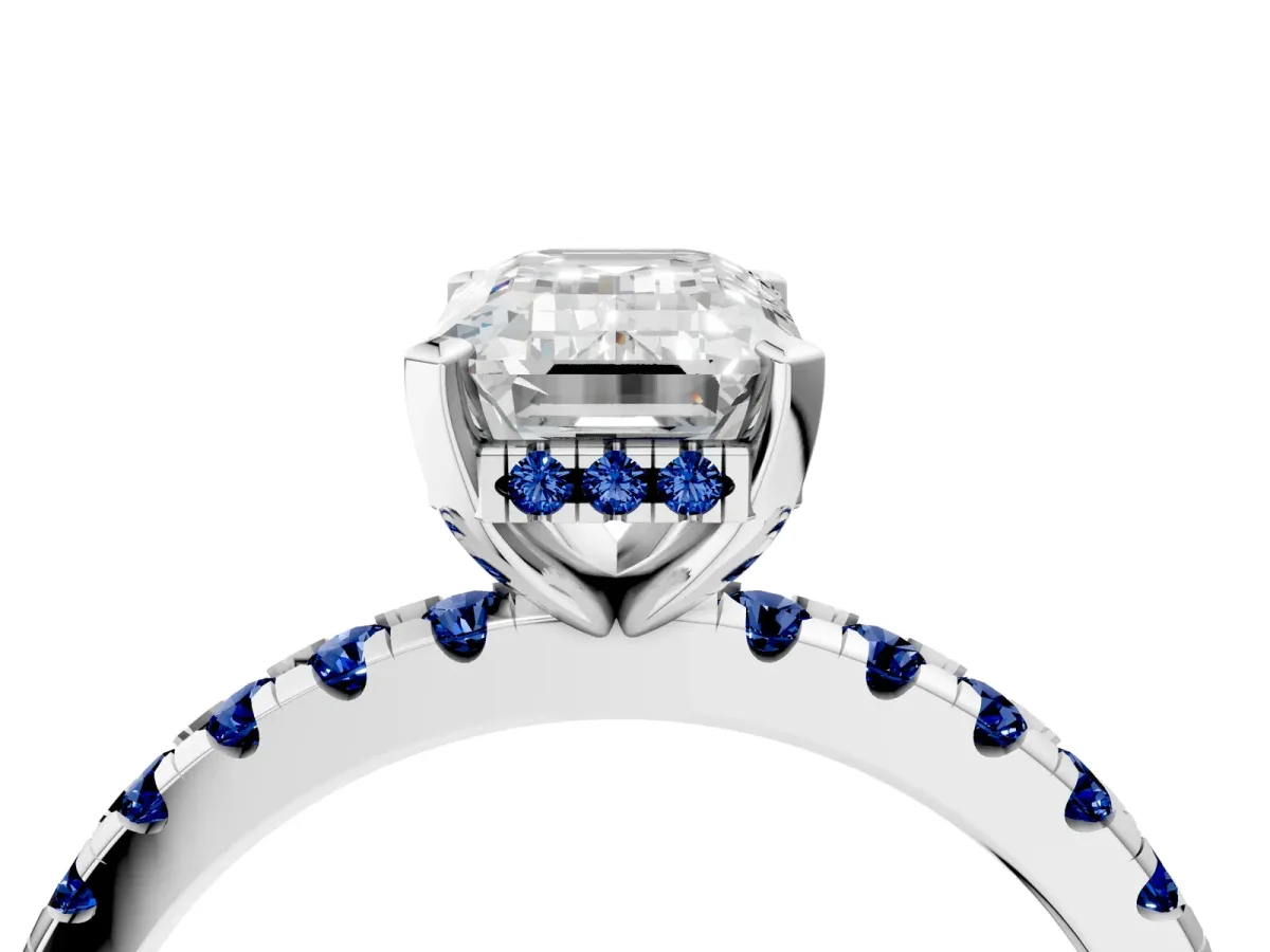 Emerald Cut Diamond Solitaire Ring with Round Blue Sapphire Pavé Band and Four-Prong Setting Silver