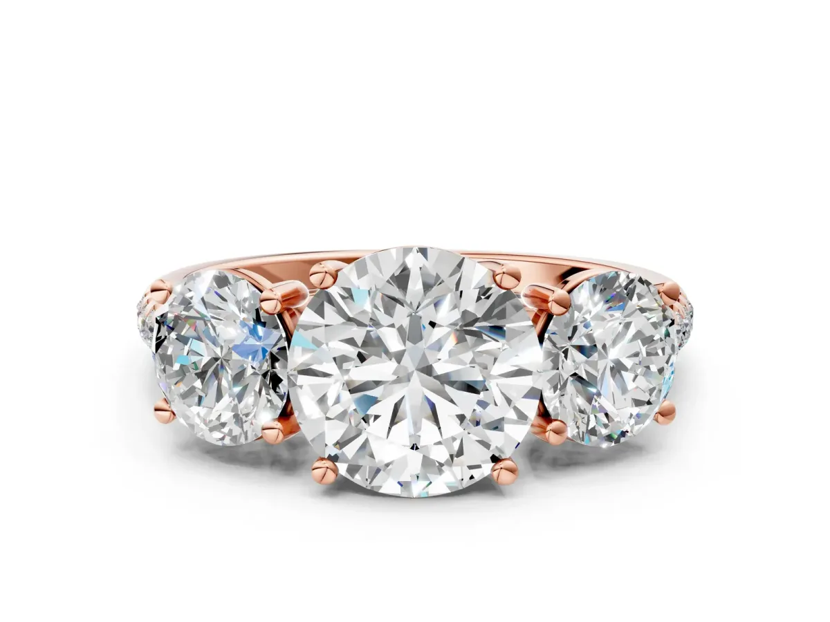 Fancy Blue Three-Stone Round Cut Diamond Ring with Round Pavé Band and Prong Setting Rose gold