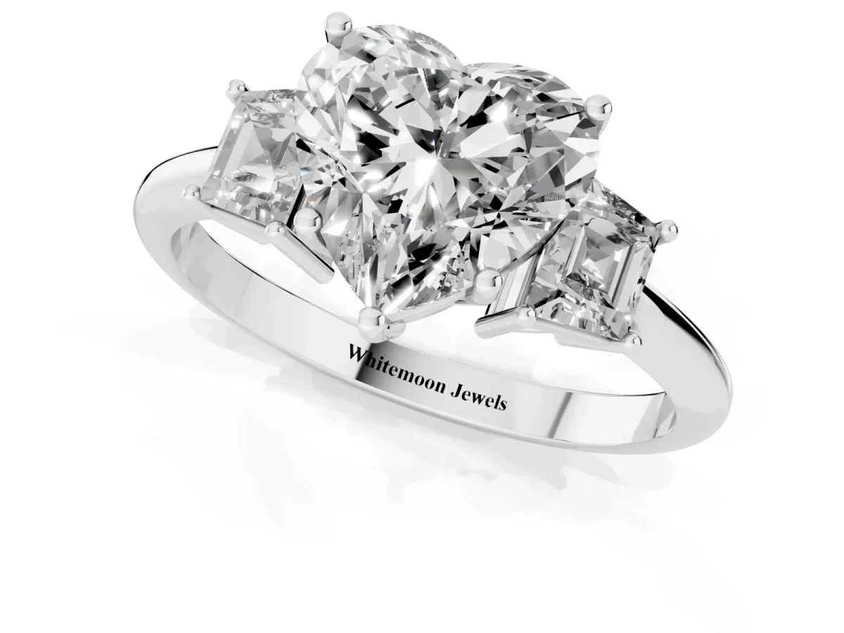 Heart Cut Diamond Three-Stone Ring with Trapezoid Side Stones and Prong Setting Platinum