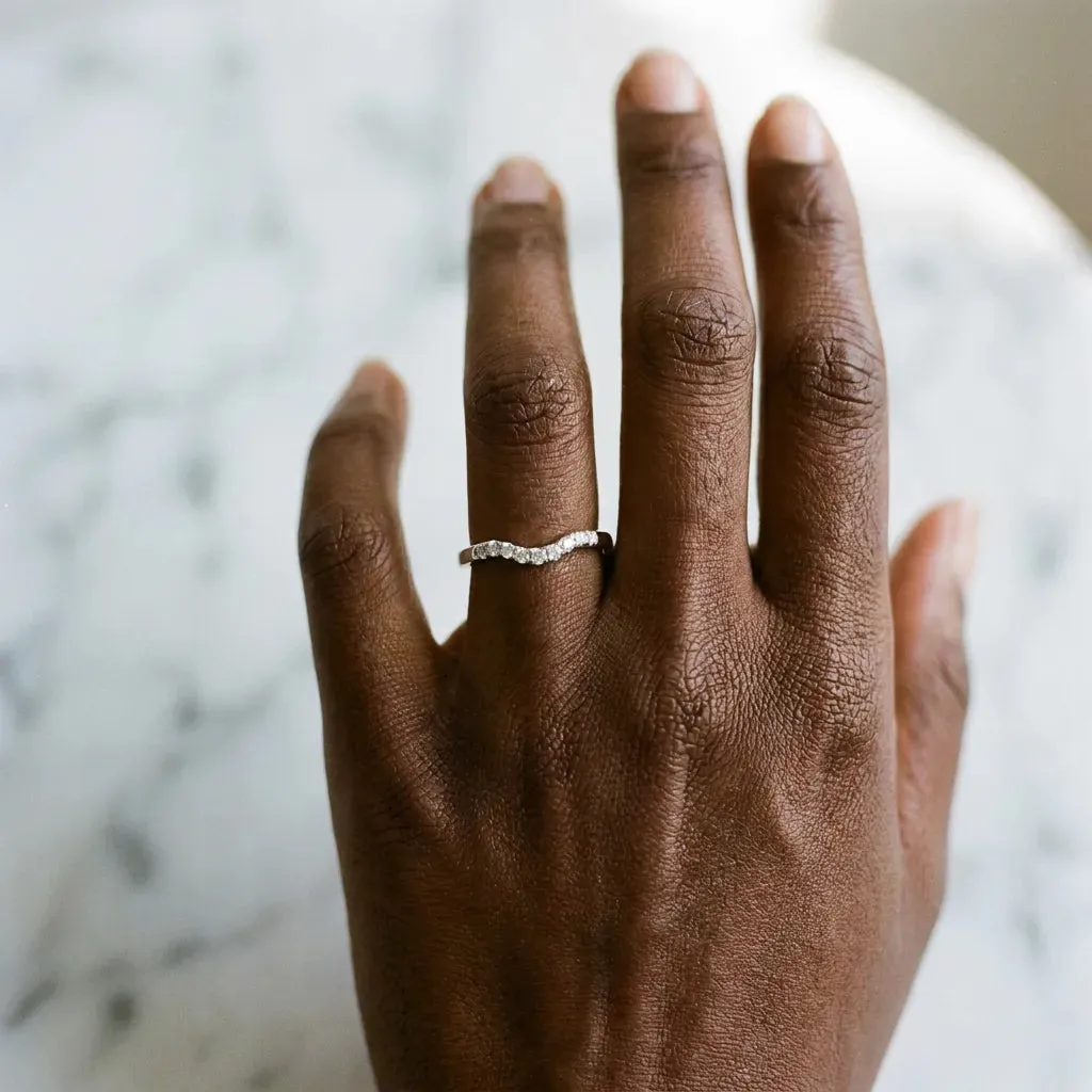 Curved Diamond Wedding Band with Round Cut Stones and Shared Prong Setting Silver