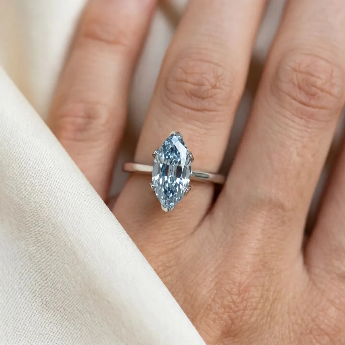 Fancy Blue Marquise Cut Diamond Solitaire Ring with Flower Prong Setting and Classic Band Silver
