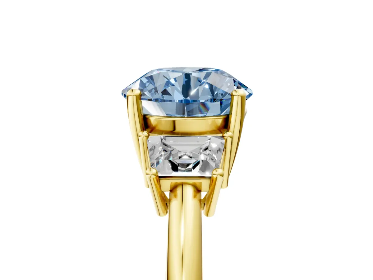 Fancy Blue Round Cut Diamond Three-Stone Ring with Trapezoid Side Stones and Prong Setting Yellow gold