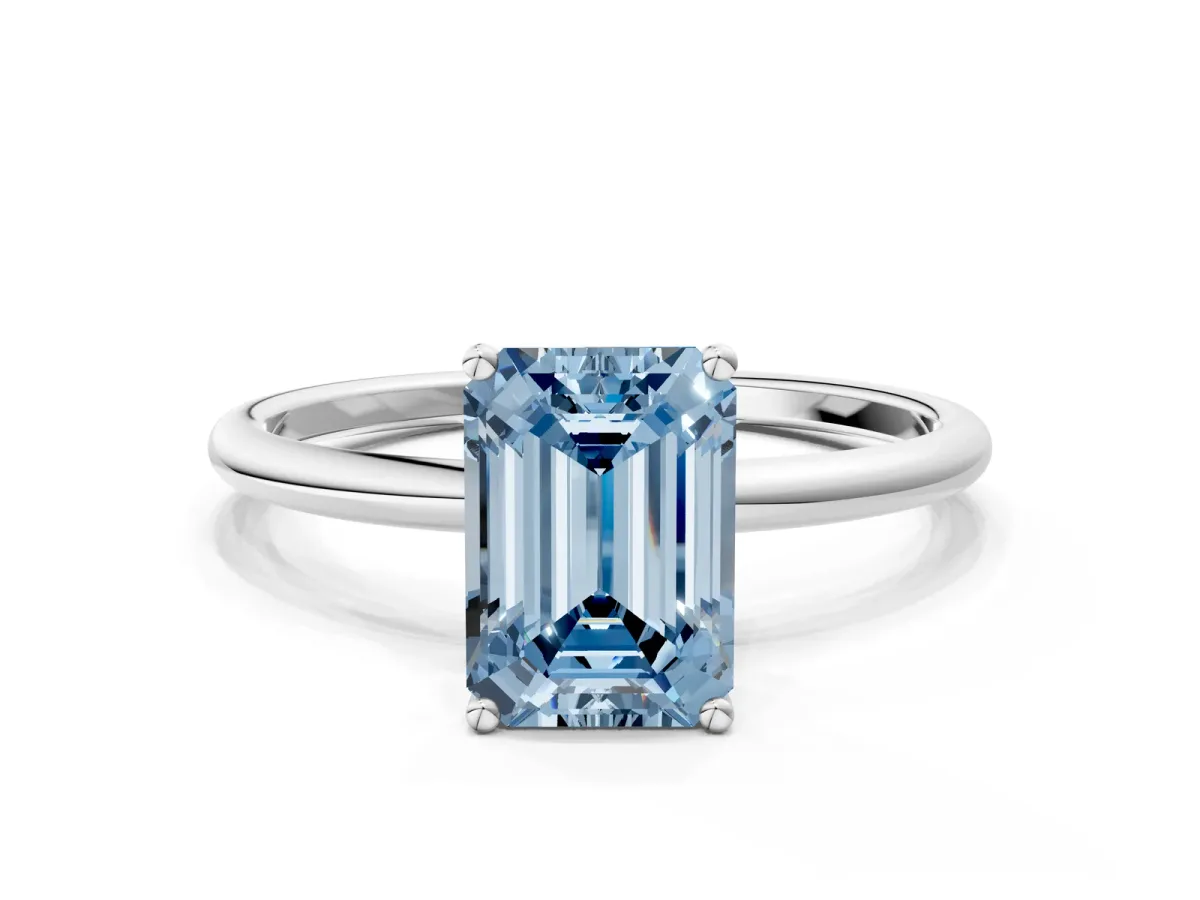 Fancy Blue Emerald Cut Cut Solitaire Engagement Ring with Thin Band and Four-Prong Setting Silver