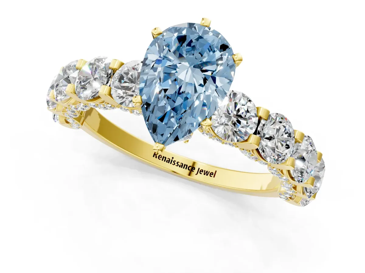 Fancy Blue Pear Cut Diamond Side Stone Engagement Ring with Four-Prong Setting Yellow gold