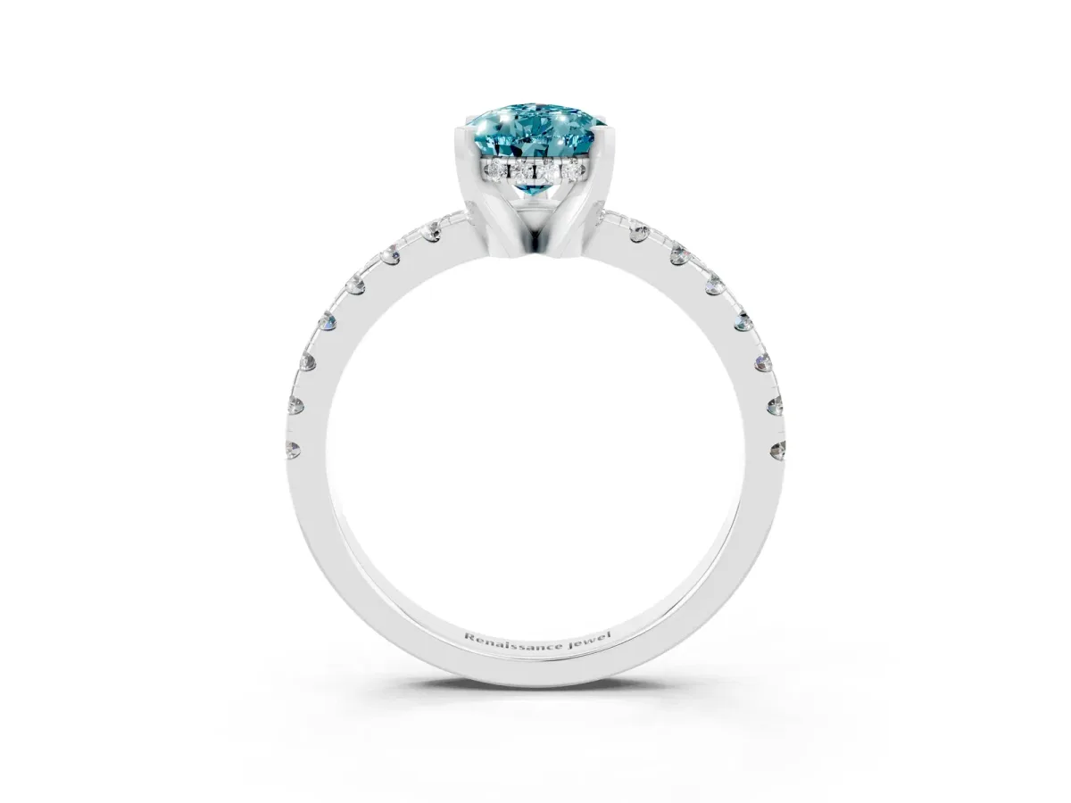 Pear Cut Blue Topaz Solitaire Ring with Round Pavé Band and Four-Prong Setting Silver