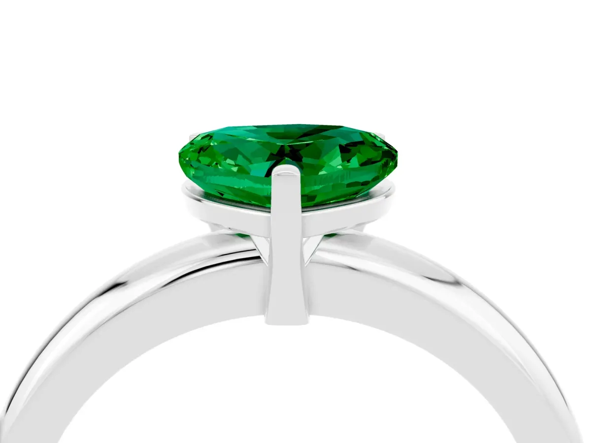 Heart Cut Emerald Solitaire Engagement Ring with Round Band and Four-Prong Setting Silver