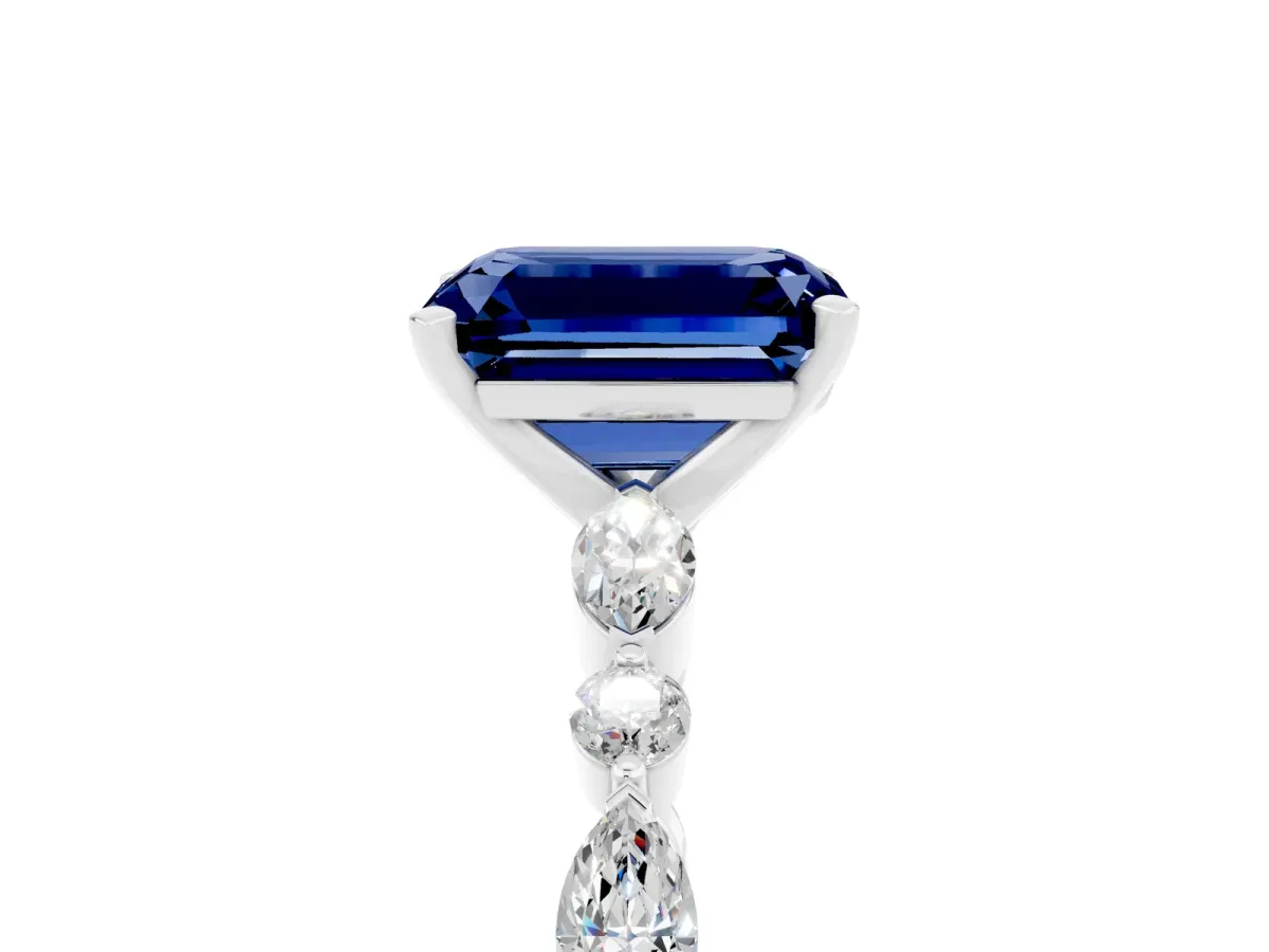 Emerald Cut Blue Sapphire Ring with Marquise and Round Side Stones and Four-Prong Setting Silver