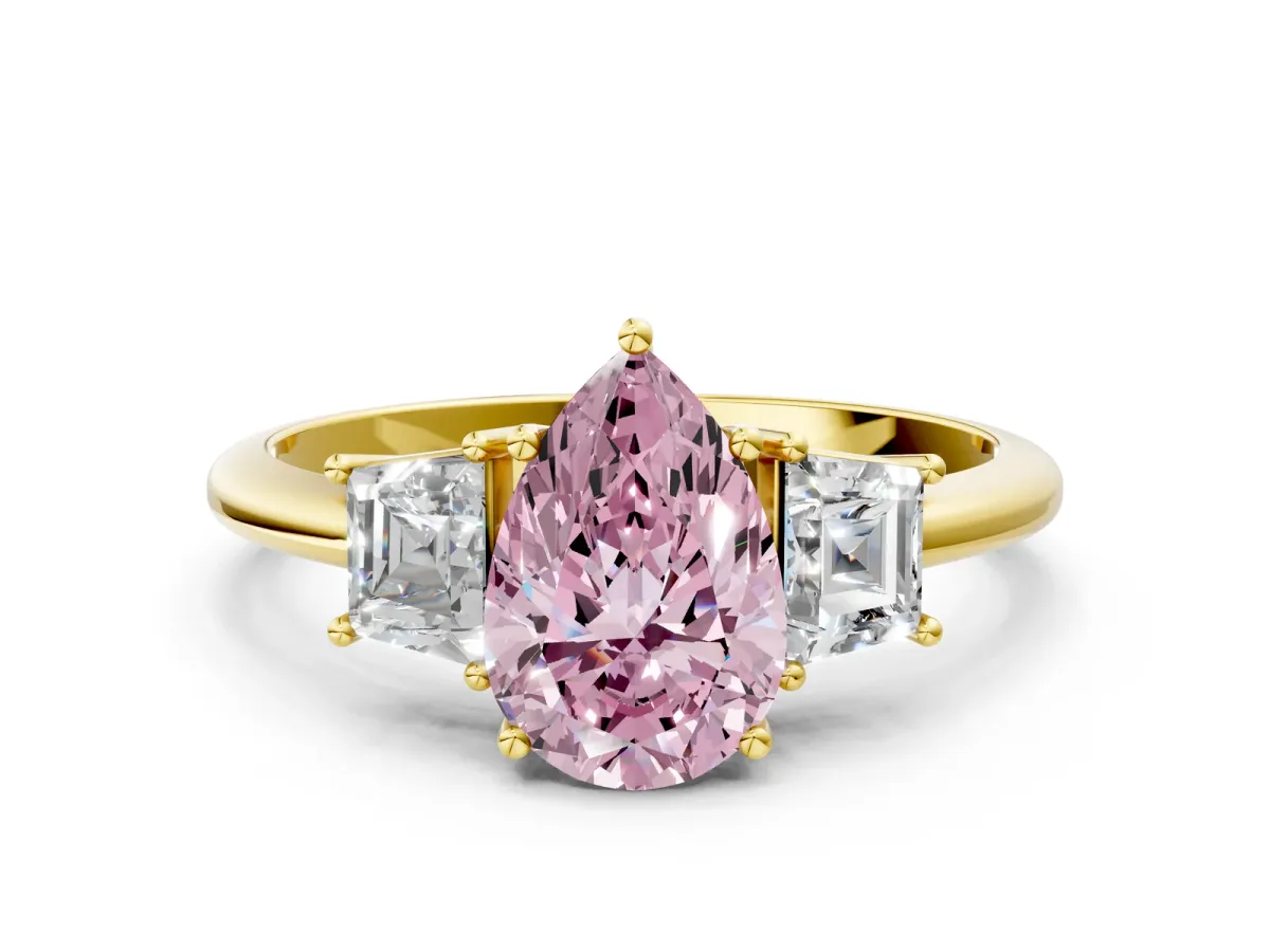 Fancy Pink Pear Cut Diamond Three-Stone Ring with Trapezoid Side Stones and Prong Setting Yellow gold