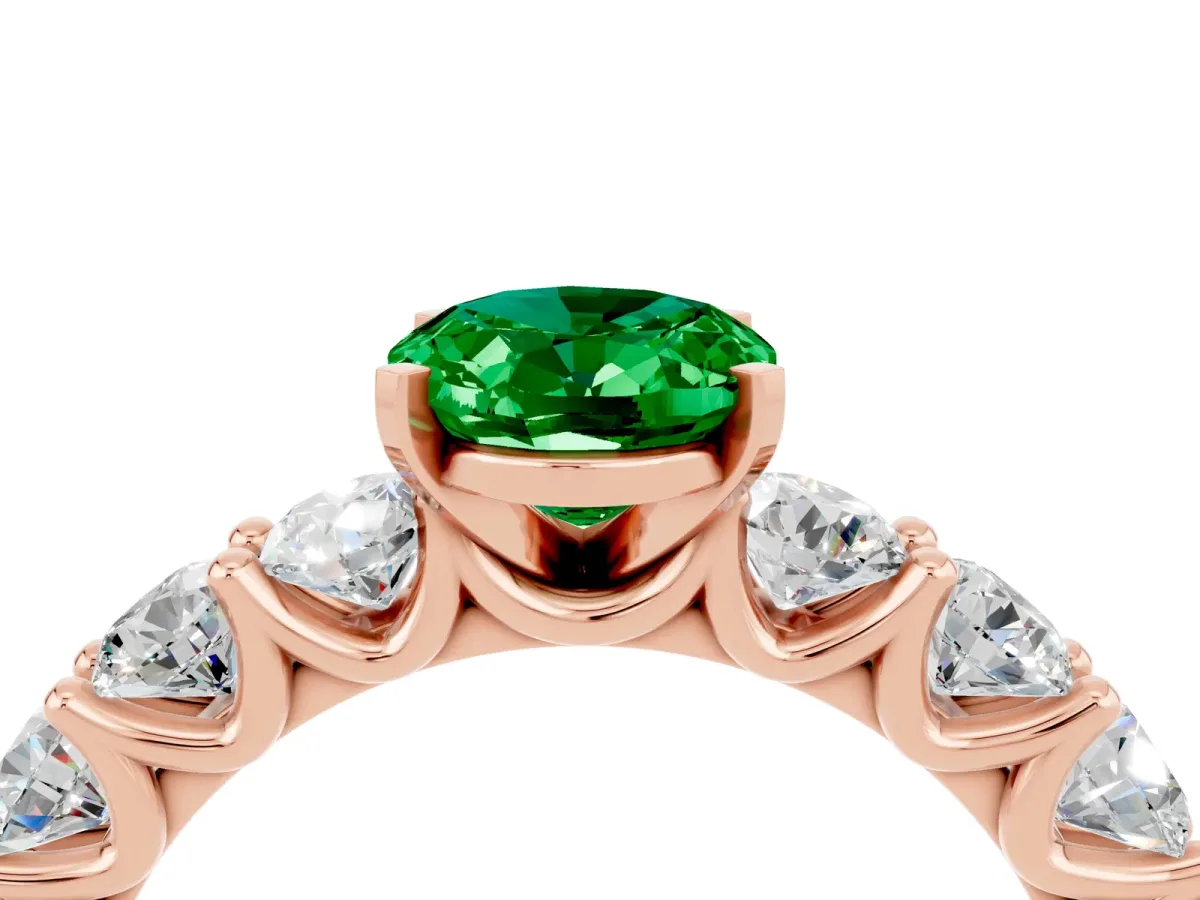 Oval Cut Emerald Prong Setting with Side Stones on a Pave Band Rose gold
