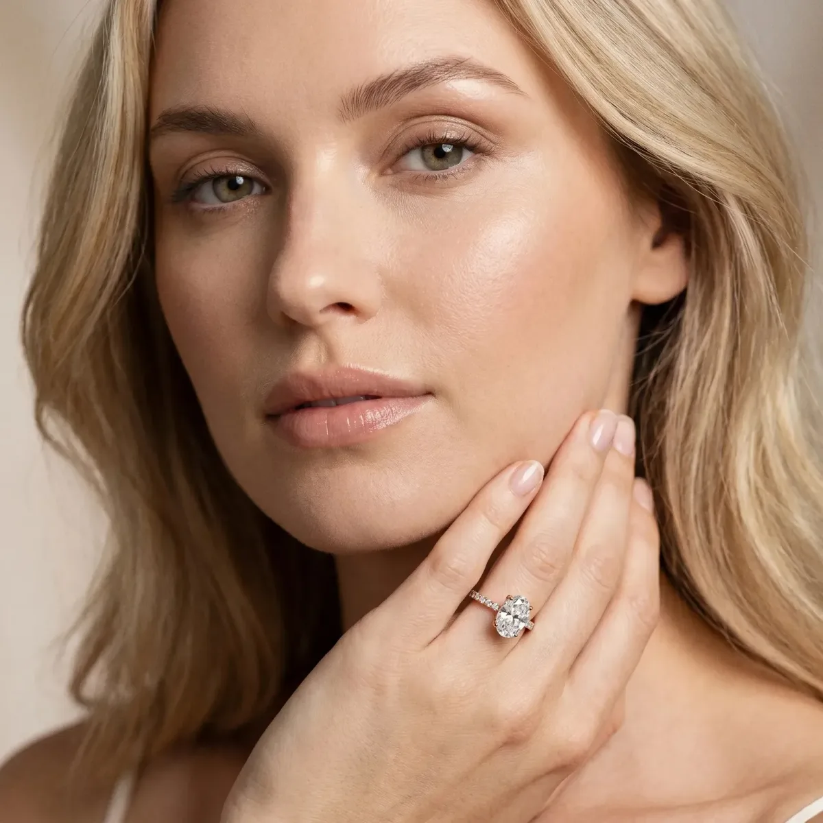 Oval Cut Diamond Solitaire Ring with Round Pavé Band and Prong Setting Rose gold